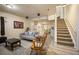 Spacious living room leading to the dining area and upstairs at 4982 S Danube St, Aurora, CO 80015