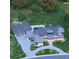 Expansive aerial view of estate with multiple garages and guest house, circular driveway, and luxurious pool and patio area at 1757 Whistlepig Ln, Broomfield, CO 80020