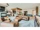 Basement featuring an open floor plan, pool table, seating area, bar, and wood beam accents at 1757 Whistlepig Ln, Broomfield, CO 80020