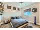 Bedroom featuring a floating bed, modern fixtures and decor, neutral colors, and carpeted floors at 1757 Whistlepig Ln, Broomfield, CO 80020
