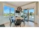 Cozy breakfast nook with backyard views, a modern light fixture, and access to outdoor patio at 1757 Whistlepig Ln, Broomfield, CO 80020