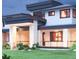 An elegant home with stone pillars, dark trim, and a manicured lawn at 1757 Whistlepig Ln, Broomfield, CO 80020
