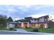 A charming home with stone columns, lush landscaping, and an inviting entrance at 1757 Whistlepig Ln, Broomfield, CO 80020