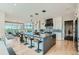 Open kitchen boasts a large island with bar seating, pendant lighting, and flows into the dining area at 1757 Whistlepig Ln, Broomfield, CO 80020