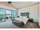 Serene main bedroom with a sitting area, plush carpet, and access to a private balcony at 1757 Whistlepig Ln, Broomfield, CO 80020