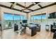 Bright home office with custom built-ins, a modern desk, and large windows offering expansive views at 1757 Whistlepig Ln, Broomfield, CO 80020