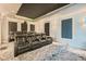 Home theater room with reclining chairs, projector, acoustic panels, and star-lit ceiling at 1757 Whistlepig Ln, Broomfield, CO 80020