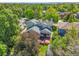 Aerial view of the property, highlighting the deck, hot tub, and lush green surroundings at 379 Lincoln Ct, Louisville, CO 80027