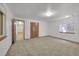 Bright bedroom features neutral carpeting, a closet and a large window at 379 Lincoln Ct, Louisville, CO 80027
