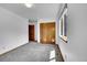 This bedroom features neutral carpeting, closet and access to the rest of the house at 379 Lincoln Ct, Louisville, CO 80027