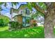 Charming two-story home with stone accents, manicured lawn and mature trees at 379 Lincoln Ct, Louisville, CO 80027