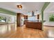 Open kitchen with modern appliances, a central island, and an adjacent dining area at 379 Lincoln Ct, Louisville, CO 80027
