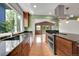 Bright kitchen showcasing a large window, stainless steel appliances, granite countertops and hardwood floors at 379 Lincoln Ct, Louisville, CO 80027