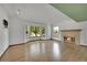 Bright living room with hardwood floors, a fireplace and a large bay window at 379 Lincoln Ct, Louisville, CO 80027