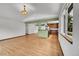 Open concept living space with hardwood floors, adjoined to kitchen area for seamless flow at 379 Lincoln Ct, Louisville, CO 80027