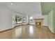 Bright living room with hardwood floors, a fireplace and a large bay window at 379 Lincoln Ct, Louisville, CO 80027