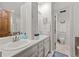 Bathroom featuring double sinks and a door leading to the toilet room at 2090 S Gray Dr, Lakewood, CO 80227