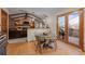 Dining area featuring hardwood floors, and access to the living room and outdoor deck at 2090 S Gray Dr, Lakewood, CO 80227