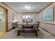 Cozy dining room with a wooden table, bench seating, and a large window for natural light at 2090 S Gray Dr, Lakewood, CO 80227