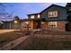 Two-story brick home with red shutters and two car garage at 2090 S Gray Dr, Lakewood, CO 80227