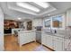 Well-lit kitchen featuring granite counters, stainless steel appliances, and hardwood floors at 2090 S Gray Dr, Lakewood, CO 80227