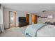 Bright main bedroom with an ensuite bathroom, a comfortable bed, and a large television at 2090 S Gray Dr, Lakewood, CO 80227
