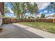 Large fenced backyard with a concrete patio perfect for entertaining and outdoor living at 14317 Olmsted Dr, Denver, CO 80239