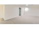 Open basement features carpeted floors, recessed lighting, and access to a staircase at 14317 Olmsted Dr, Denver, CO 80239