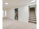 Basement features carpeted floors, recessed lighting, and open staircase at 14317 Olmsted Dr, Denver, CO 80239