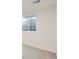 This basement is newly renovated with neutral carpet and a bright window at 14317 Olmsted Dr, Denver, CO 80239