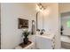 Well-lit bathroom features a classic design with a framed art piece at 14317 Olmsted Dr, Denver, CO 80239