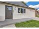 Charming home exterior with modern front door and attached one-car garage at 14317 Olmsted Dr, Denver, CO 80239