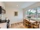 Eat-in kitchen features stainless steel appliances and modern hardwood floors at 14317 Olmsted Dr, Denver, CO 80239