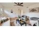 Inviting living room showcasing a modern ceiling fan and open layout at 14317 Olmsted Dr, Denver, CO 80239
