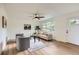 Bright living room featuring stylish furnishings and modern ceiling fan at 14317 Olmsted Dr, Denver, CO 80239