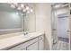 Bright bathroom showcasing a vanity with a single sink and ample lighting at 12148 E Kepner Pl, Aurora, CO 80012