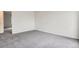 Spacious bedroom featuring neutral carpet and white walls at 12148 E Kepner Pl, Aurora, CO 80012