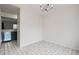 Well-lit dining room features stylish chandelier and tile flooring at 12148 E Kepner Pl, Aurora, CO 80012