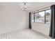 Dining room with tile flooring, chandelier, and large window at 12148 E Kepner Pl, Aurora, CO 80012