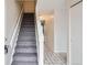 View of the entryway with a staircase, tiled floor, and a coat closet at 12148 E Kepner Pl, Aurora, CO 80012
