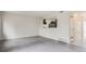 Photo shows living room with wood-style flooring and view into kitchen at 12148 E Kepner Pl, Aurora, CO 80012