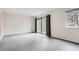Spacious living room with wood-style flooring and large sliding glass doors at 12148 E Kepner Pl, Aurora, CO 80012