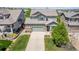 Aerial view of the home featuring a well-maintained lawn and a two car garage at 16671 E Prairie Goat Ave, Parker, CO 80134