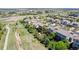 Aerial view of home with backyard, walking path, green space, and mature trees at 16671 E Prairie Goat Ave, Parker, CO 80134