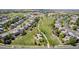 Aerial view of neighborhood, green park, walking path, playground with shelter, and single Gathering homes at 16671 E Prairie Goat Ave, Parker, CO 80134