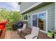 Relaxing back deck with outdoor seating, grill, and sliding glass door access to the home at 16671 E Prairie Goat Ave, Parker, CO 80134