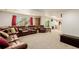 Finished basement features a living area with comfortable seating, adjacent to the bar at 16671 E Prairie Goat Ave, Parker, CO 80134