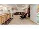 Spacious basement area boasts a comfortable seating arrangement and large windows at 16671 E Prairie Goat Ave, Parker, CO 80134