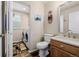 Bathroom and laundry area with vanity and updated fixtures at 16671 E Prairie Goat Ave, Parker, CO 80134