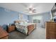 Bright bedroom with large window and light blue walls at 16671 E Prairie Goat Ave, Parker, CO 80134